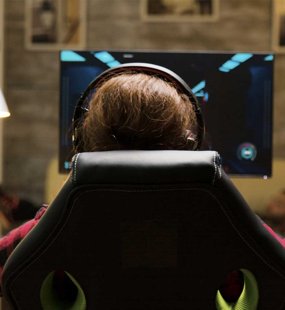Dolly shot of woman sitting on gaming chair Dolly shot of woman sitting on gaming chair