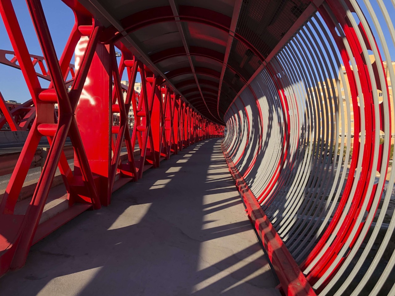 Modern red bridge in the city of Alicante, Costa Blanca, Spain, Europe Modern red bridge in the city of Alicante, Costa Blanca, Spain, Europe